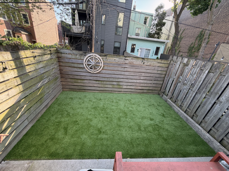 East Kensington backyard gets some nice and comfortable Garden Mark - Montana artificial turf.